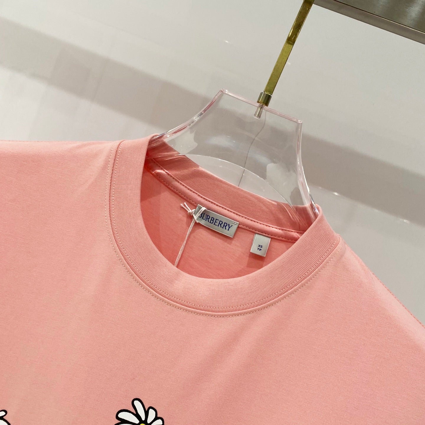 Pink Burberry T-shirt neckline with inner neck label detail.