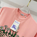 Pink Burberry T-shirt crewneck with hanging tag near the chest.