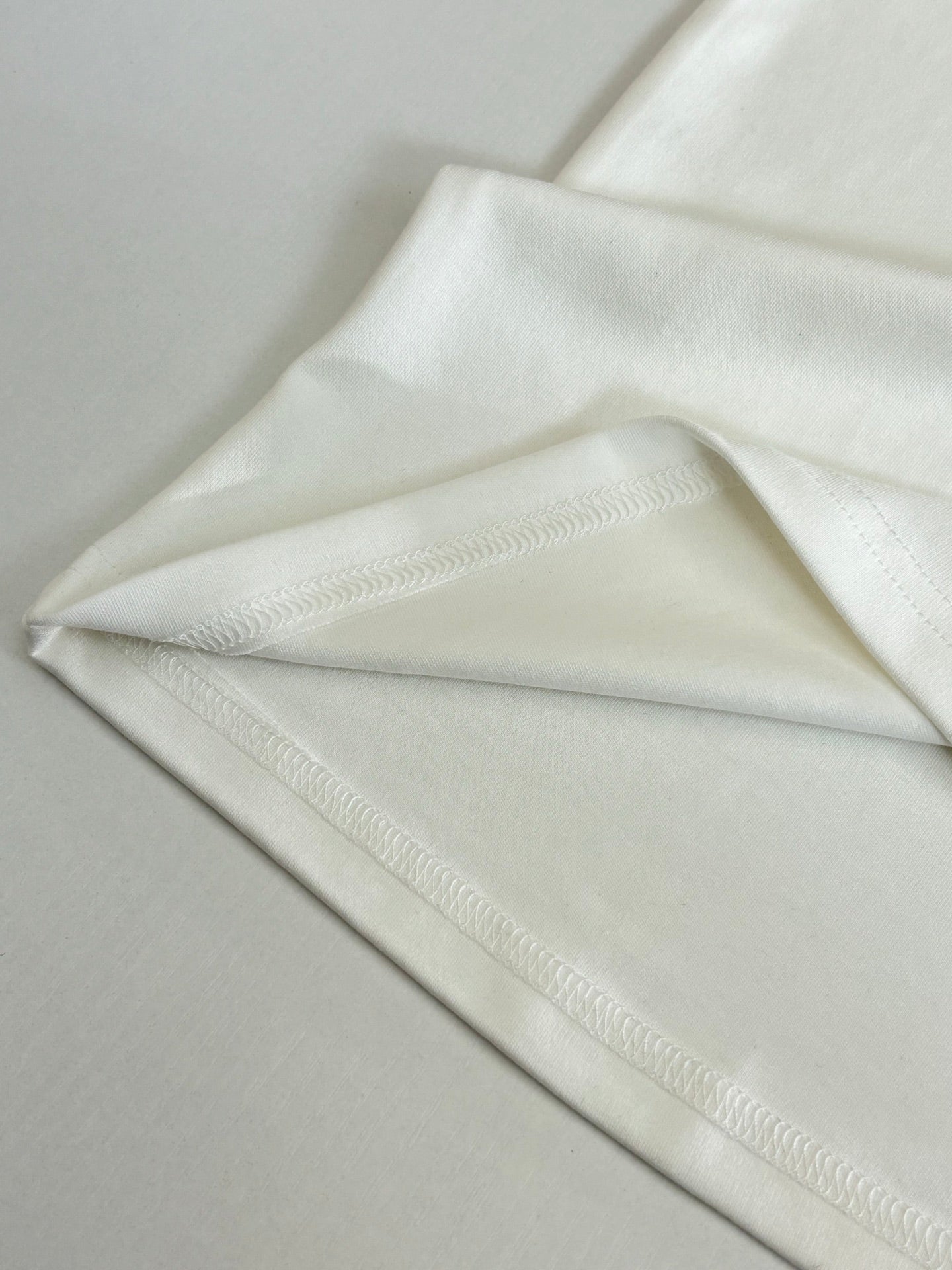 Louis Vuitton white T-shirt sleeve hem detail