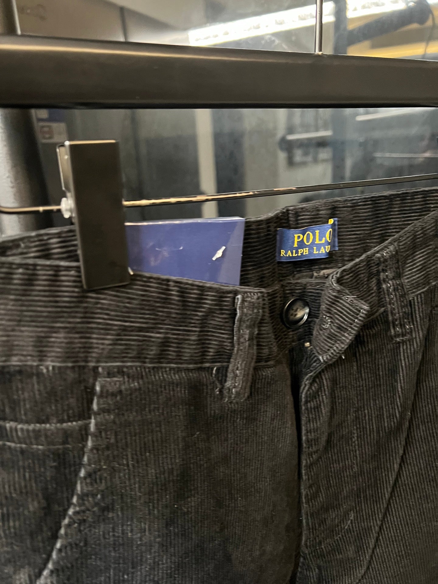 Dark corduroy jeans with coin pocket and metal button detail