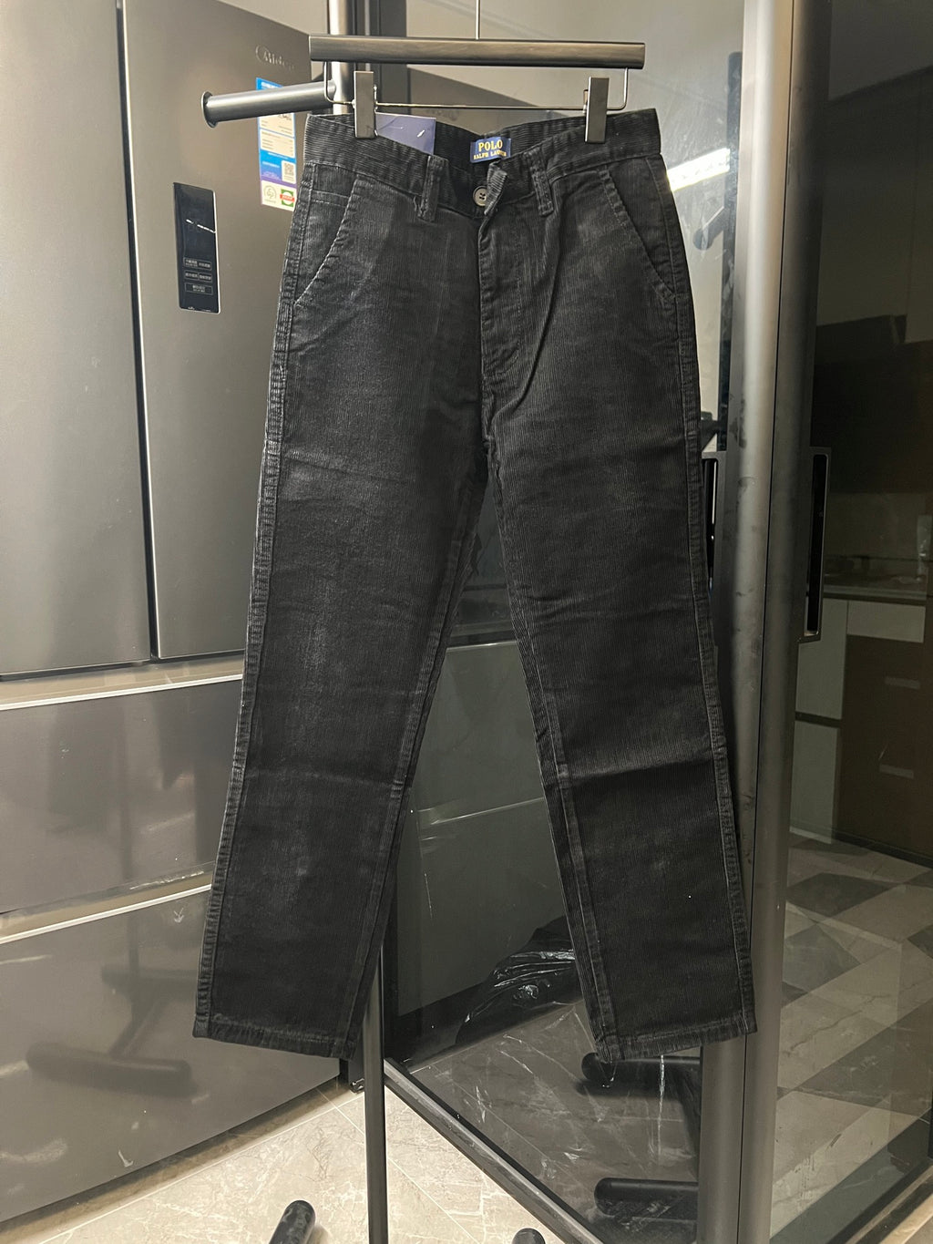 Dark gray corduroy jeans with zip fly and belt loops