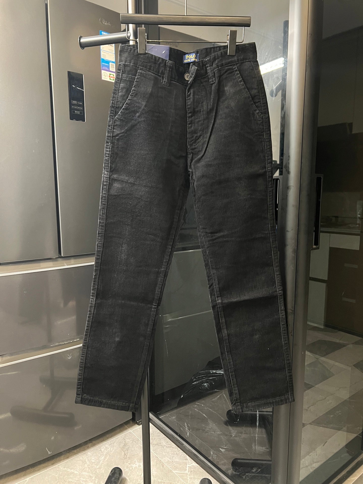 Dark gray corduroy jeans with zip fly and belt loops