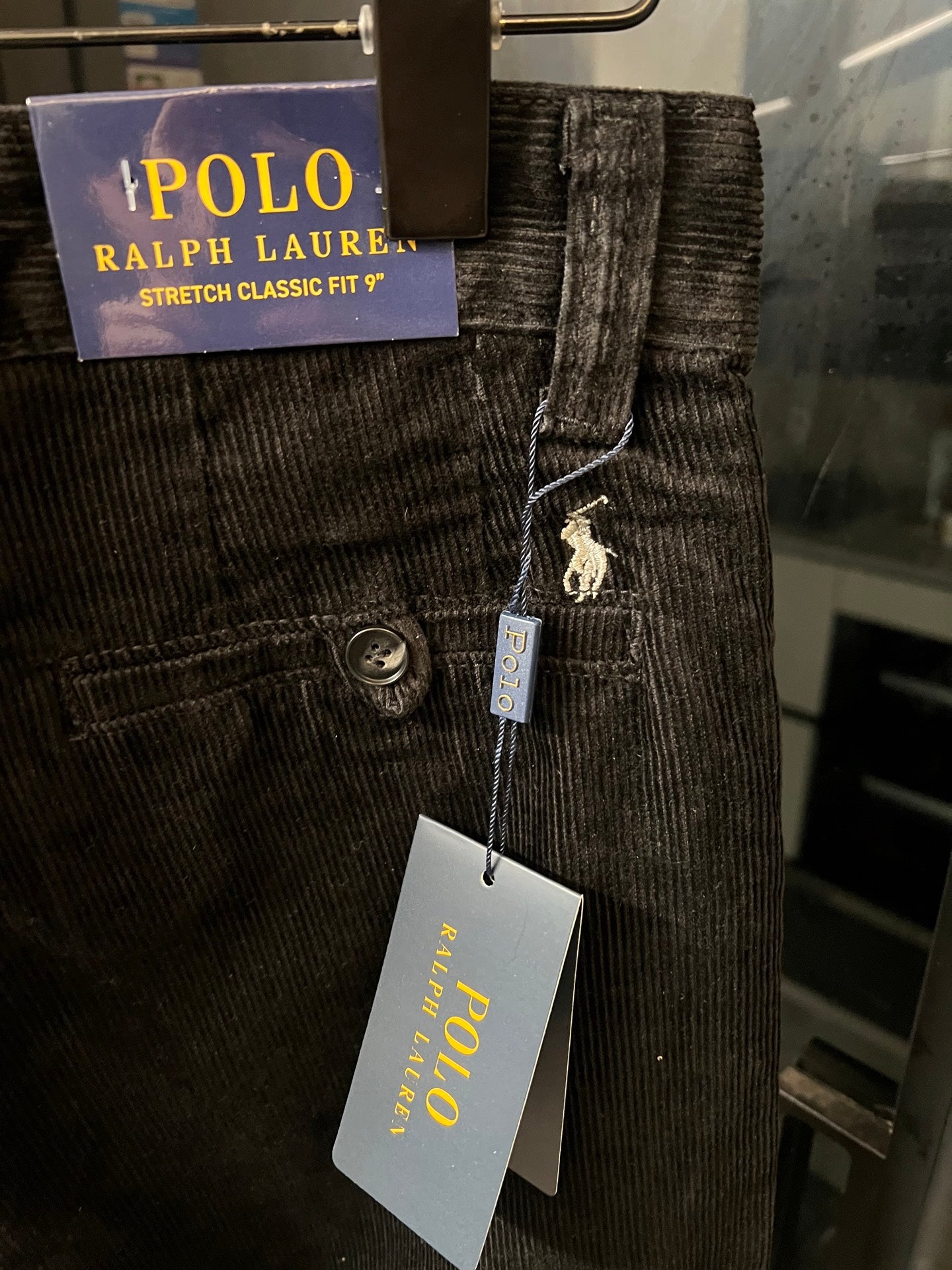 Corduroy jeans with POLO Ralph Lauren label and hanging price tag