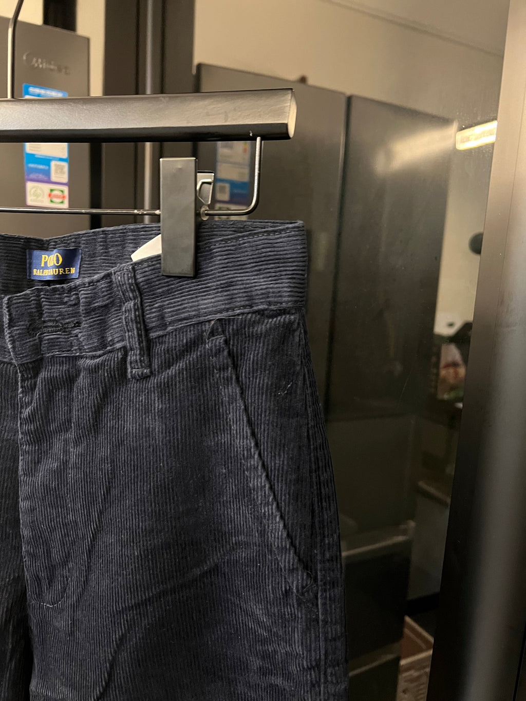 Denim jeans front with zipper fly, belt loops, and slanted side pockets