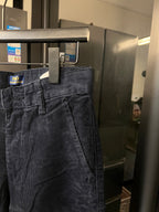 Denim jeans front with zipper fly, belt loops, and slanted side pockets