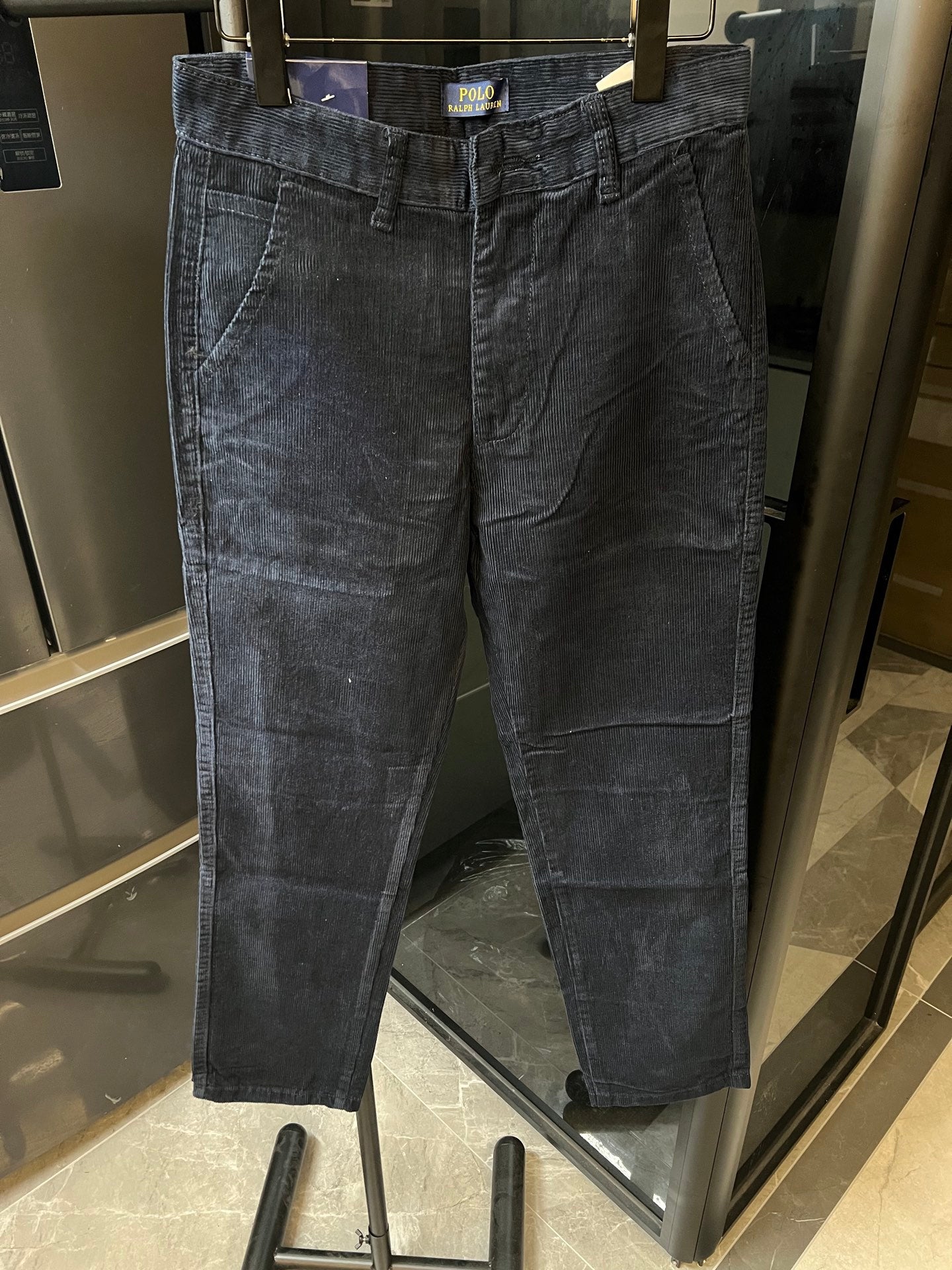Blue denim straight-leg jeans with back yoke seams and belt loops