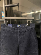 Dark blue denim jeans waist with belt loops and buttoned front