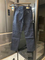 Dark blue denim jeans with fly front, belt loops, and side pockets