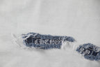 Hem embroidery and stitched trim on T-shirt fabric