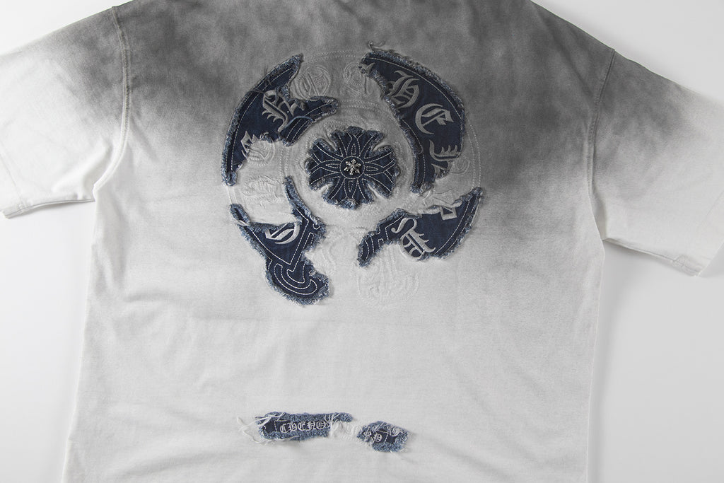 Gradient T-shirt, dark gray to white, centered navy embroidered crest with small emblem