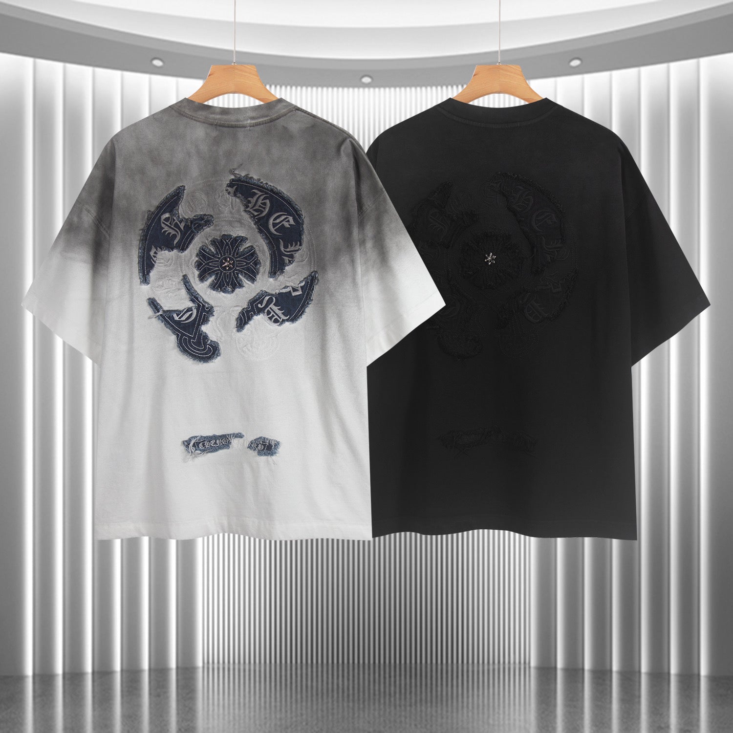 Pair of T-shirts: gradient light gray to white and solid black, each with embroidered emblem
