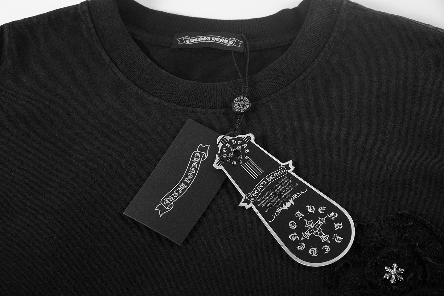 Black short-sleeve T-shirt with crew neck and embroidered chest graphic