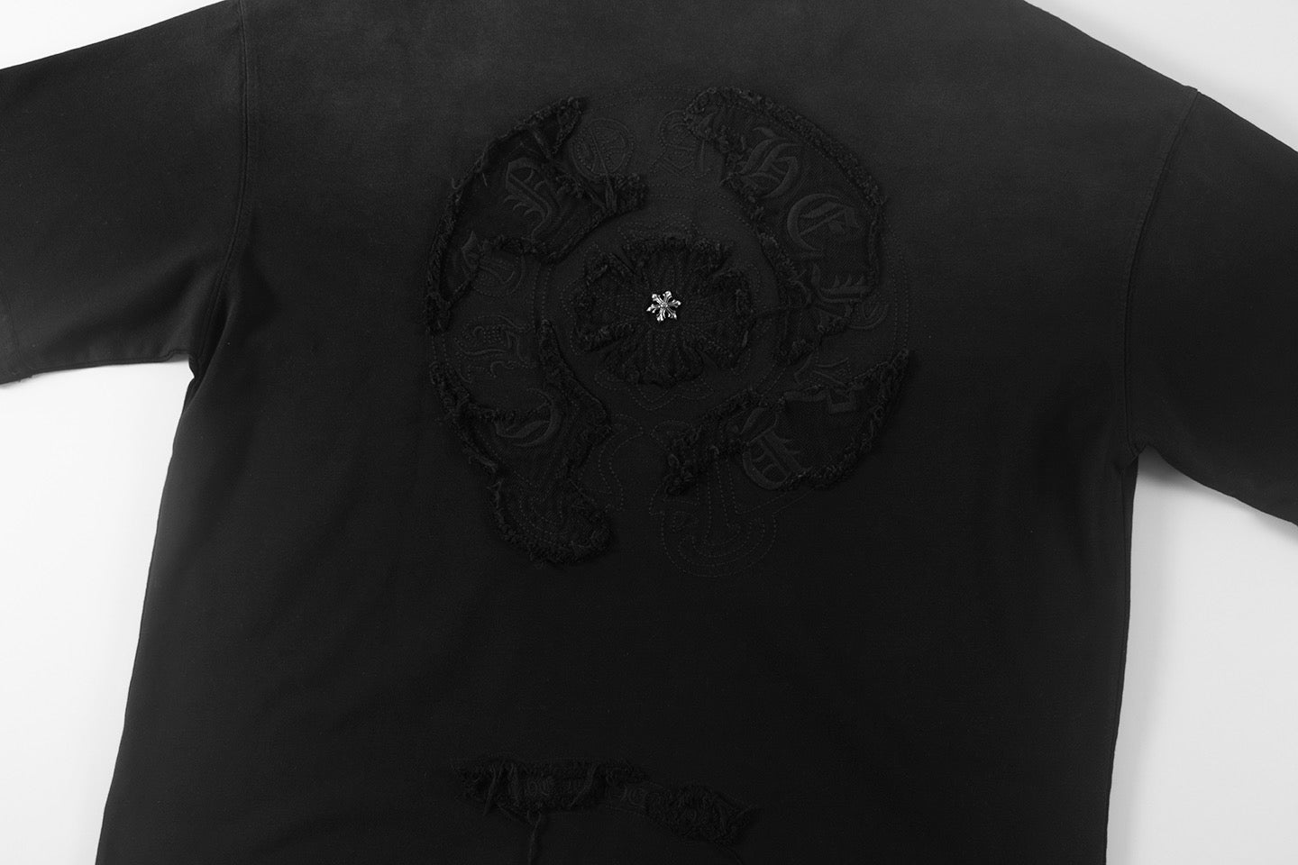 Black short-sleeve T-shirt with large embroidered chest graphic
