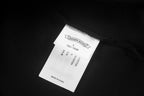 Black short-sleeve T-shirt neck label and collar seam
