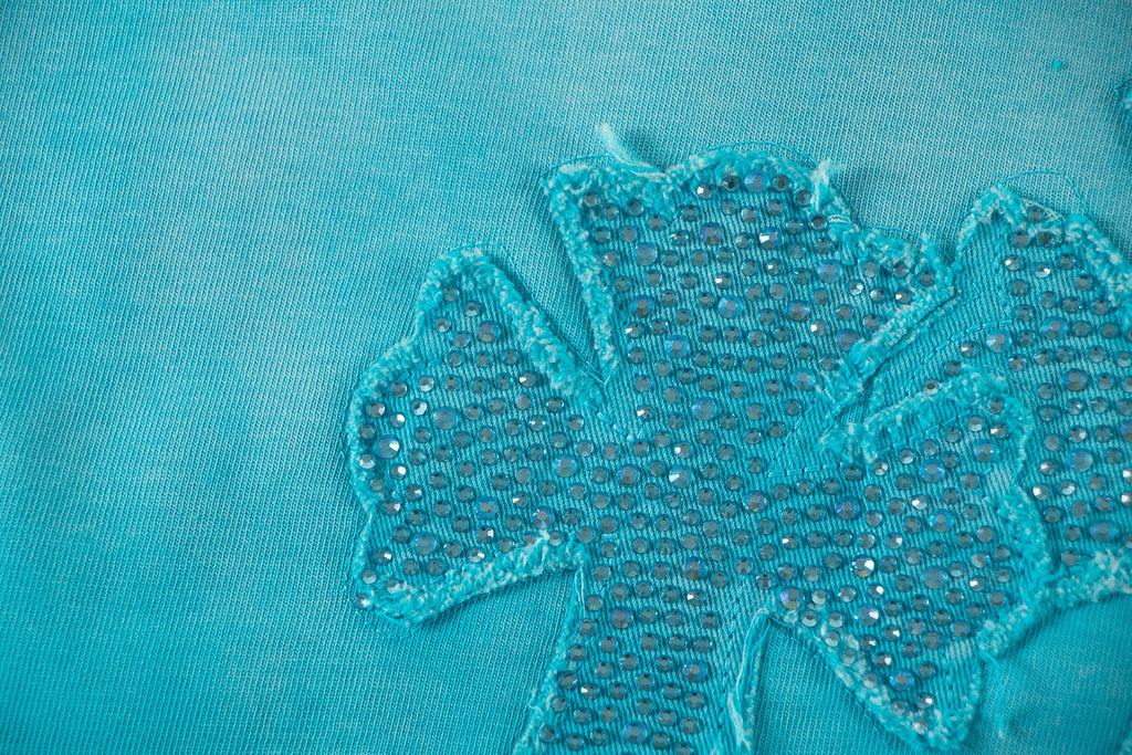 Turquoise T-shirt with textured glitter floral applique detail