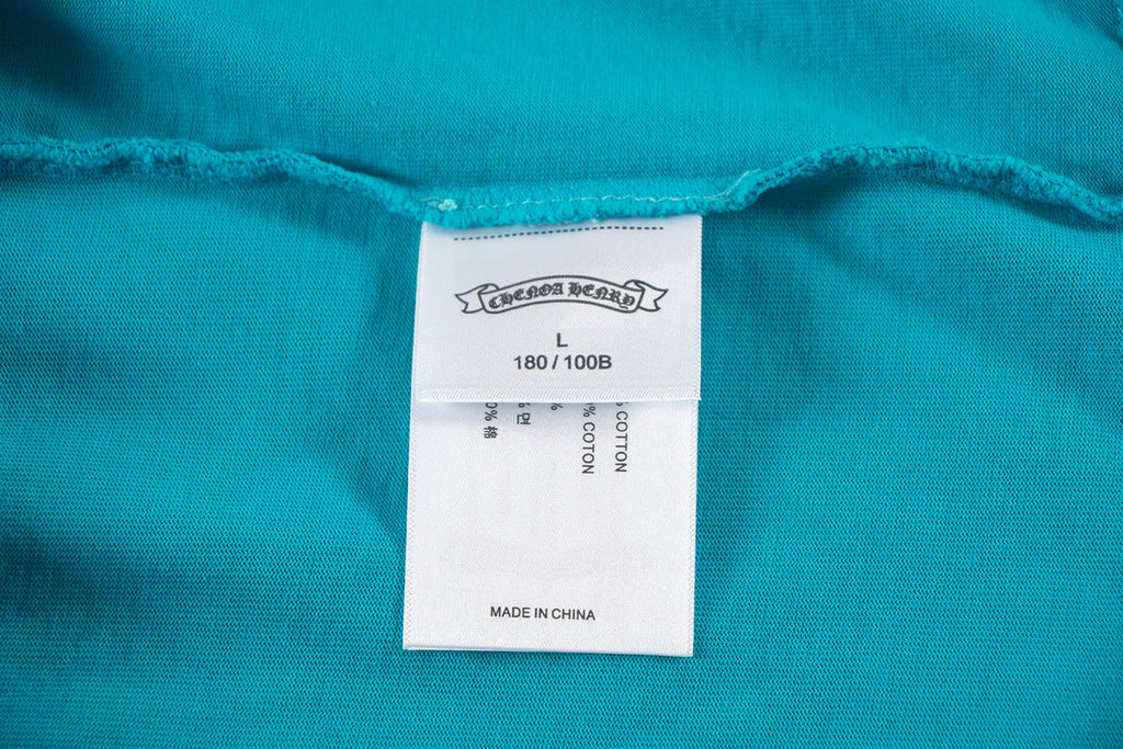 Turquoise T-shirt with size label 180/100B and Made in China tag