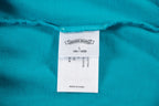 Turquoise T-shirt with size label 180/100B and Made in China tag