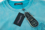 Turquoise crewneck T-shirt with neckline trim and hanging brand tags