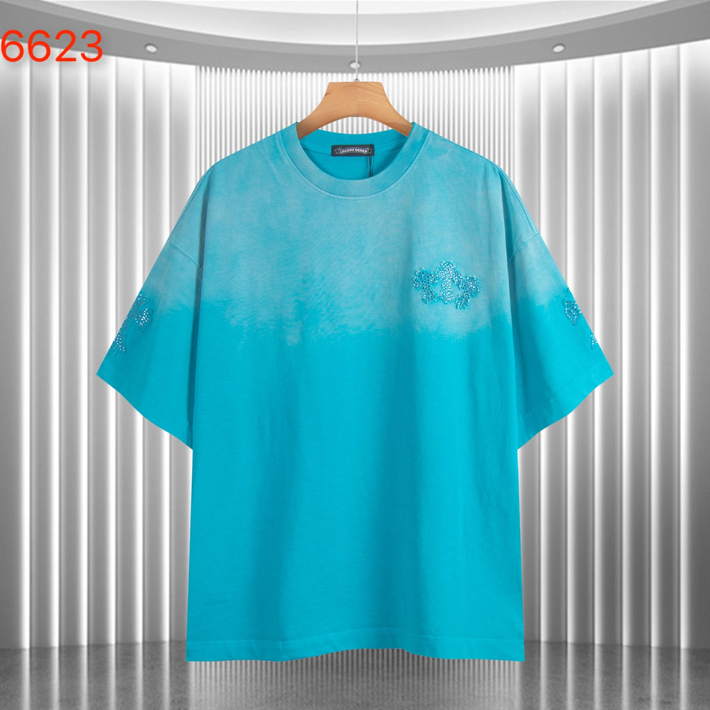 Turquoise crewneck T-shirt with short sleeves and glittery chest graphic