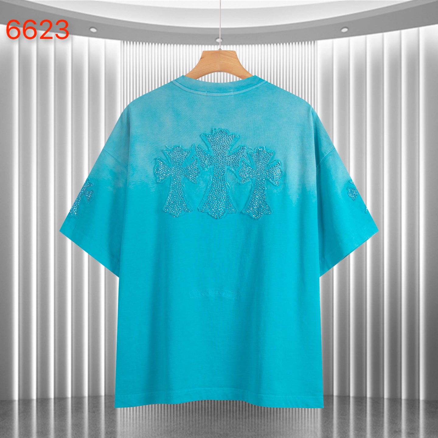 Turquoise crewneck T-shirt with short sleeves and glittery back graphic