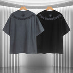 Two graphic T-shirts, one dark gray and one black, shown from the back