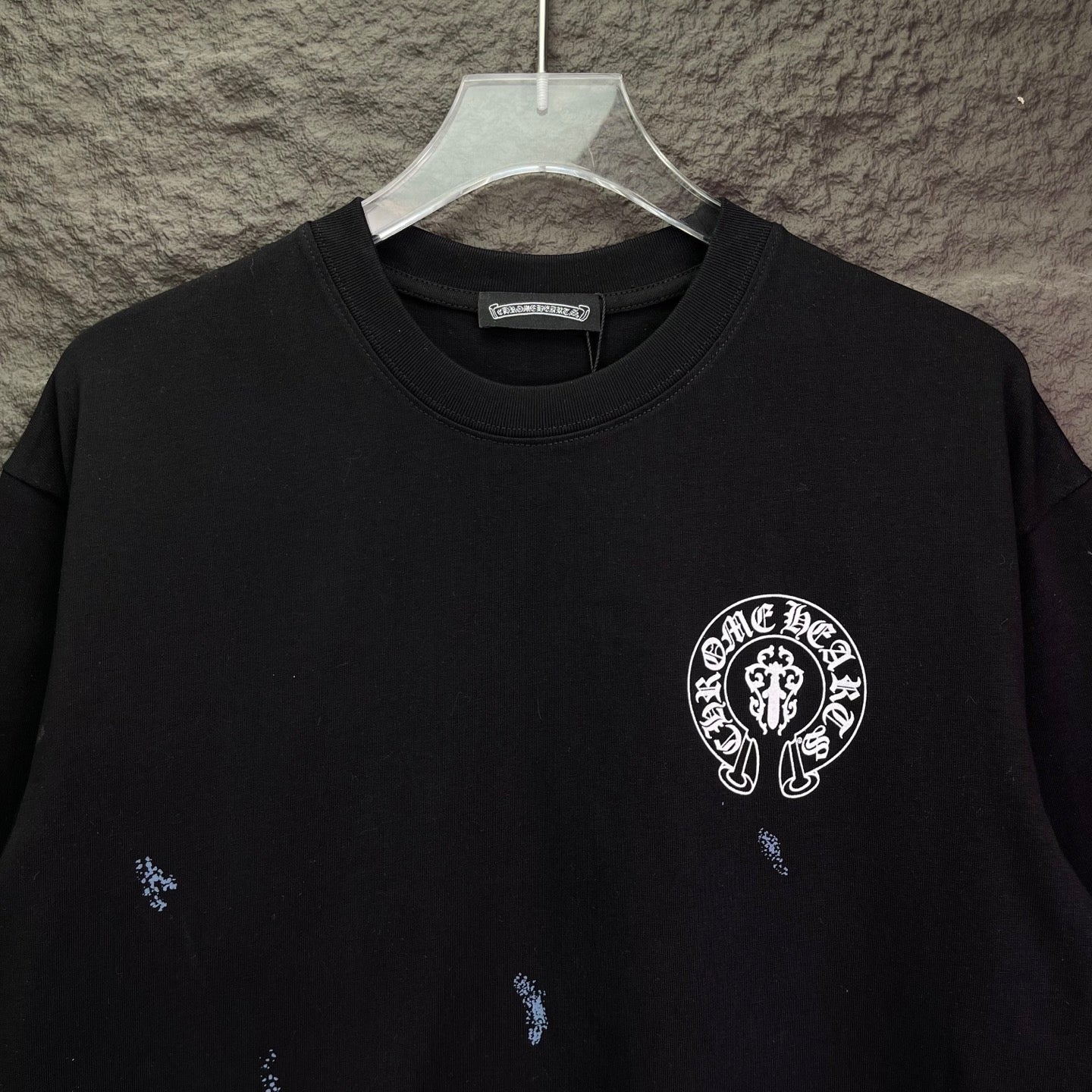 Chrome short-sleeve T-shirt close-up, black with circular chest emblem print