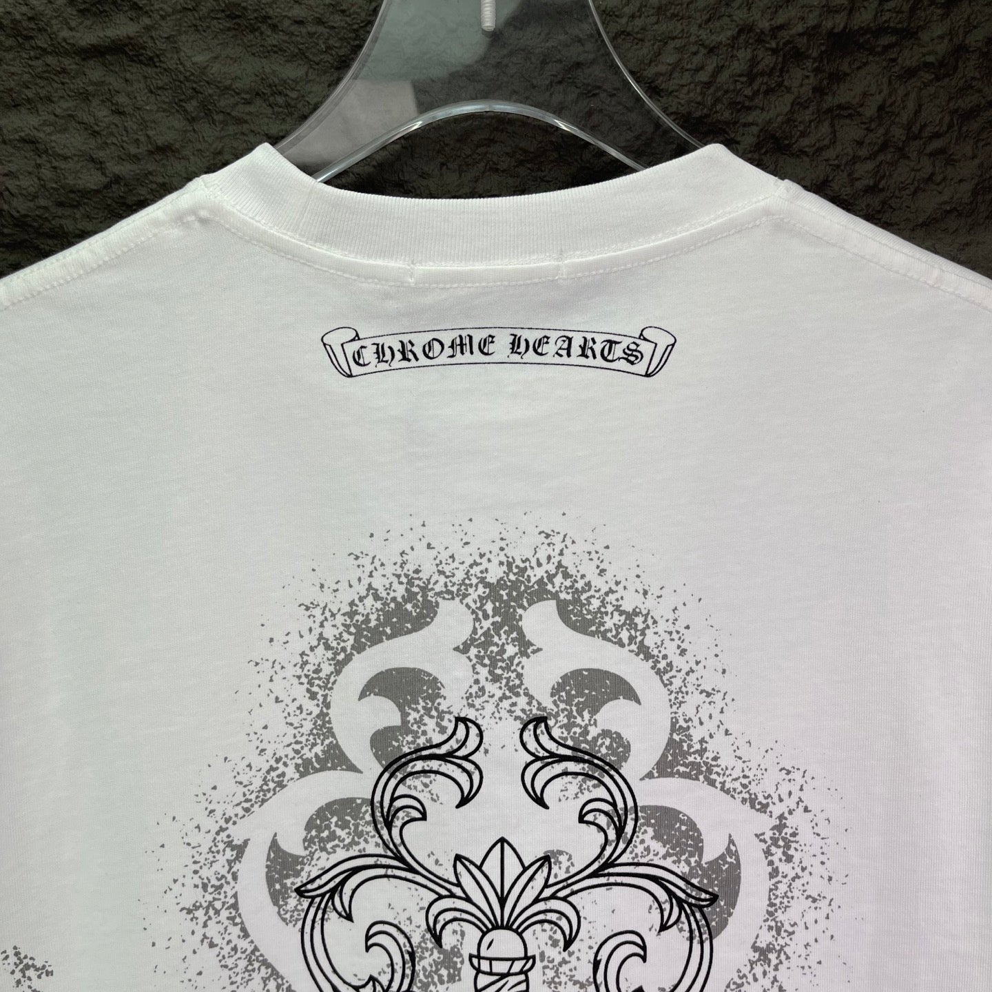 White short-sleeve T-shirt back with logo wordmark near collar and large crest