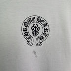 White short-sleeve T-shirt with circular crest logo chest graphic