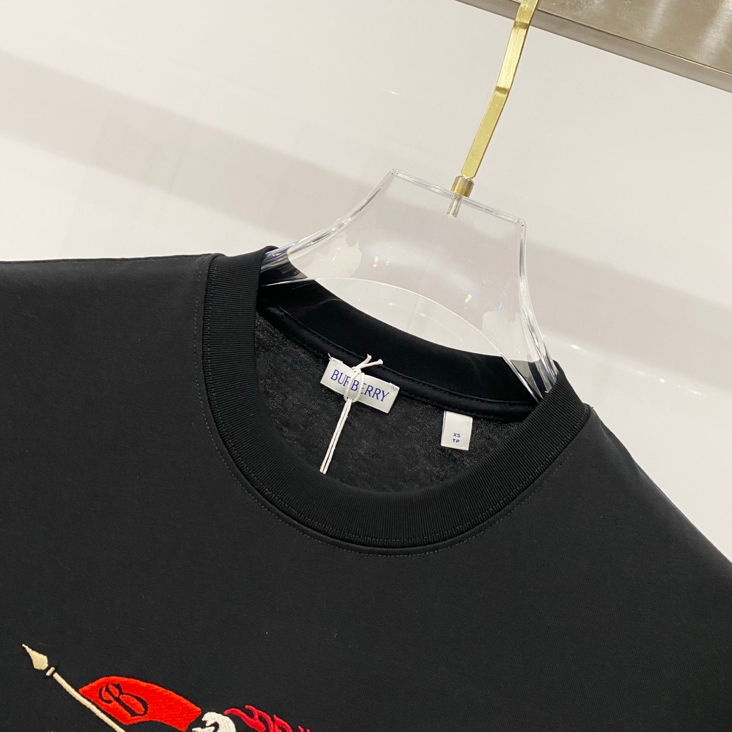 Black crew-neck T-shirt with Burberry logo label inside collar