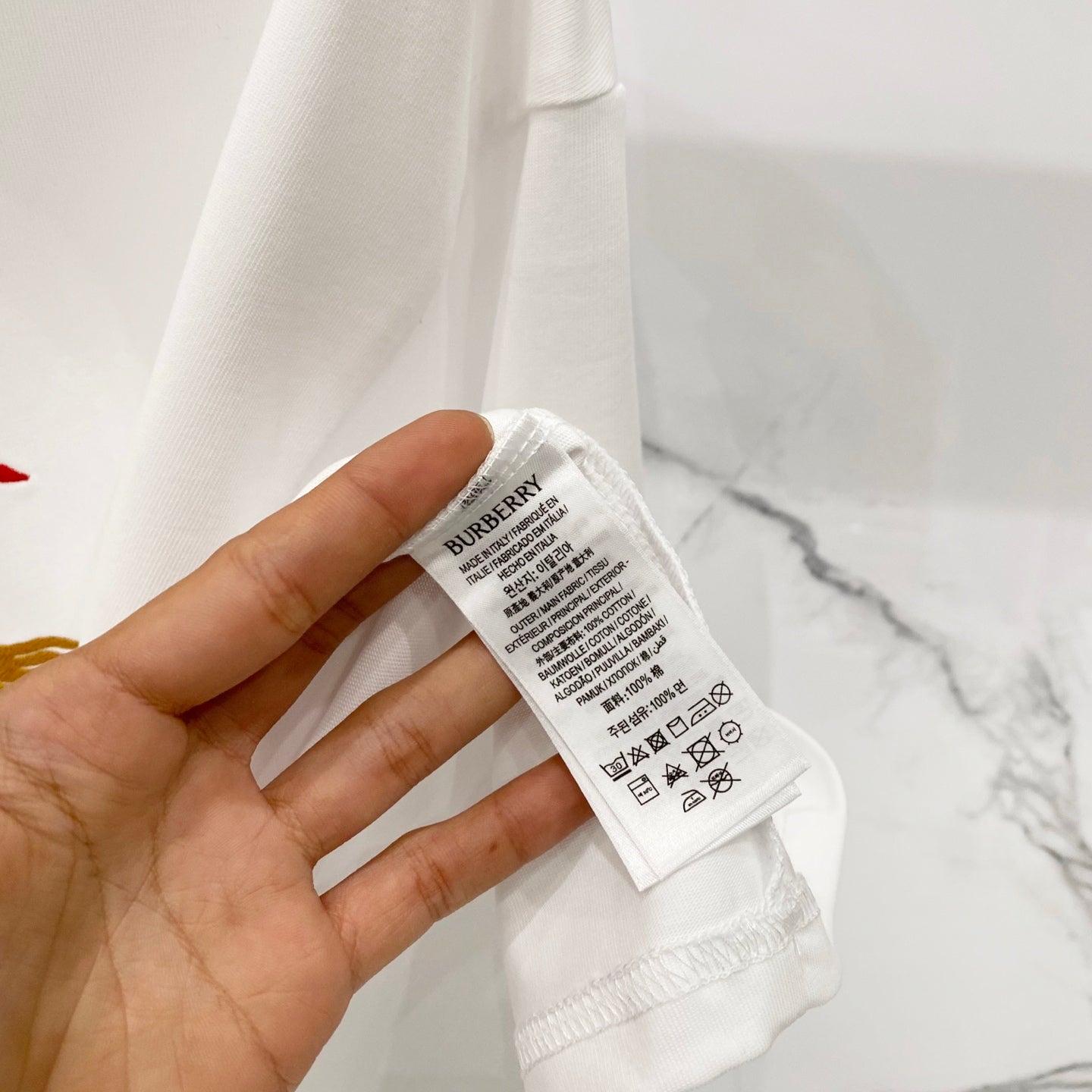 Burberry white T-shirt inside care label on hem