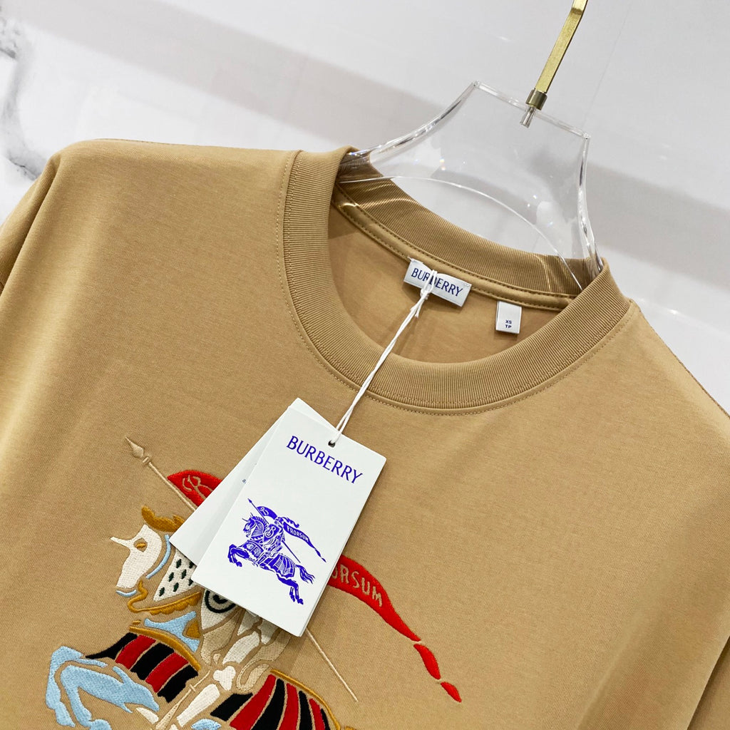 Tan short-sleeve T-shirt with embroidered cartoon horse graphic on the chest