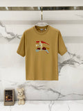 Tan short-sleeve T-shirt with multicolor cartoon horse graphic at center