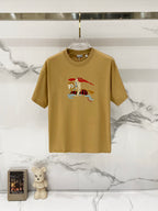 Tan short-sleeve T-shirt with multicolor cartoon horse graphic at center