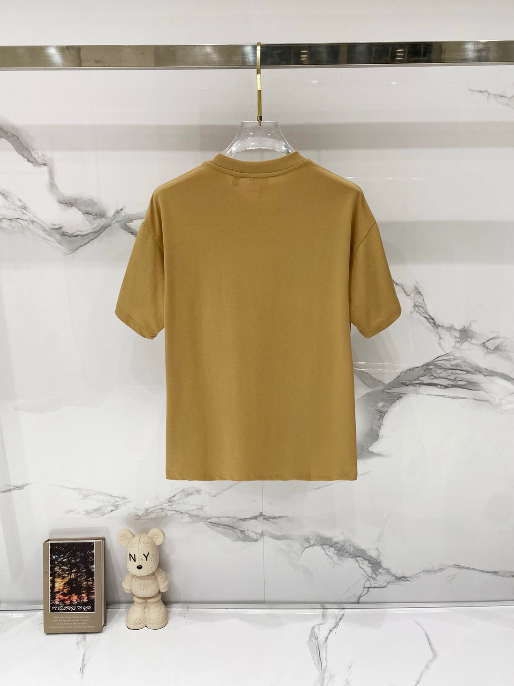 Tan short-sleeve T-shirt, back view, ribbed crew neck