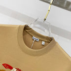 Tan short-sleeve T-shirt neckline with Burberry logo label and ribbed collar