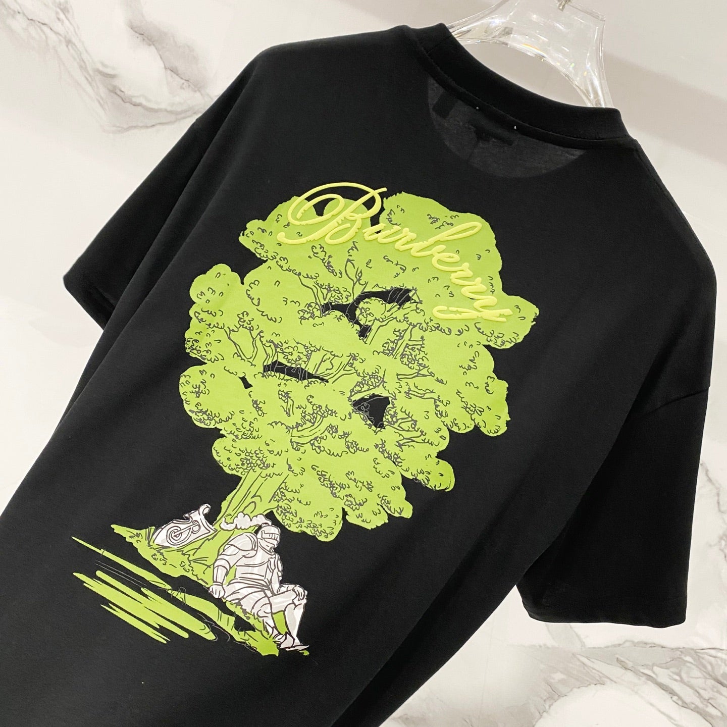 Black crewneck T-shirt with neon green and white back graphic