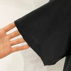 Black T-shirt sleeve hem with neat stitching