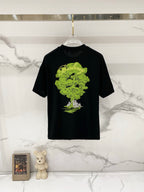 Black crewneck T-shirt with large neon green artwork graphic