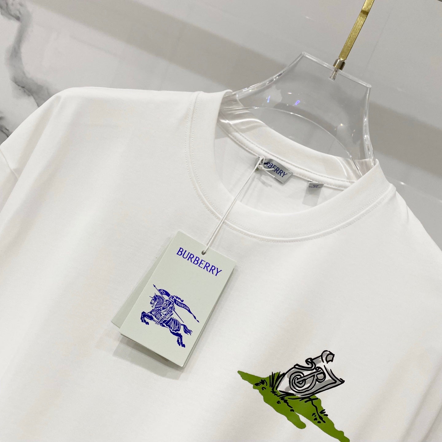 Burberry white crew-neck T-shirt with green graphic print and attached tag