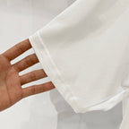 Burberry white T-shirt fabric sleeve cuff with visible stitching and seam