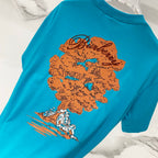 Turquoise short-sleeve T-shirt with colorful floral and bird artwork