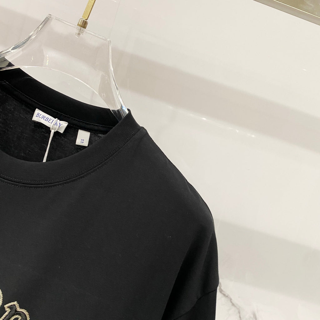 Black crewneck T-shirt with inner neck label visible