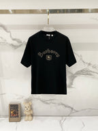 Black crewneck T-shirt with Burberry-style gold embroidery logo