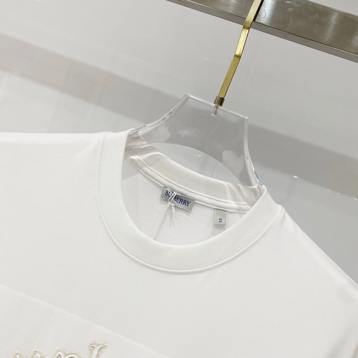 White crew-neck T-shirt with Burberry label at the neckline