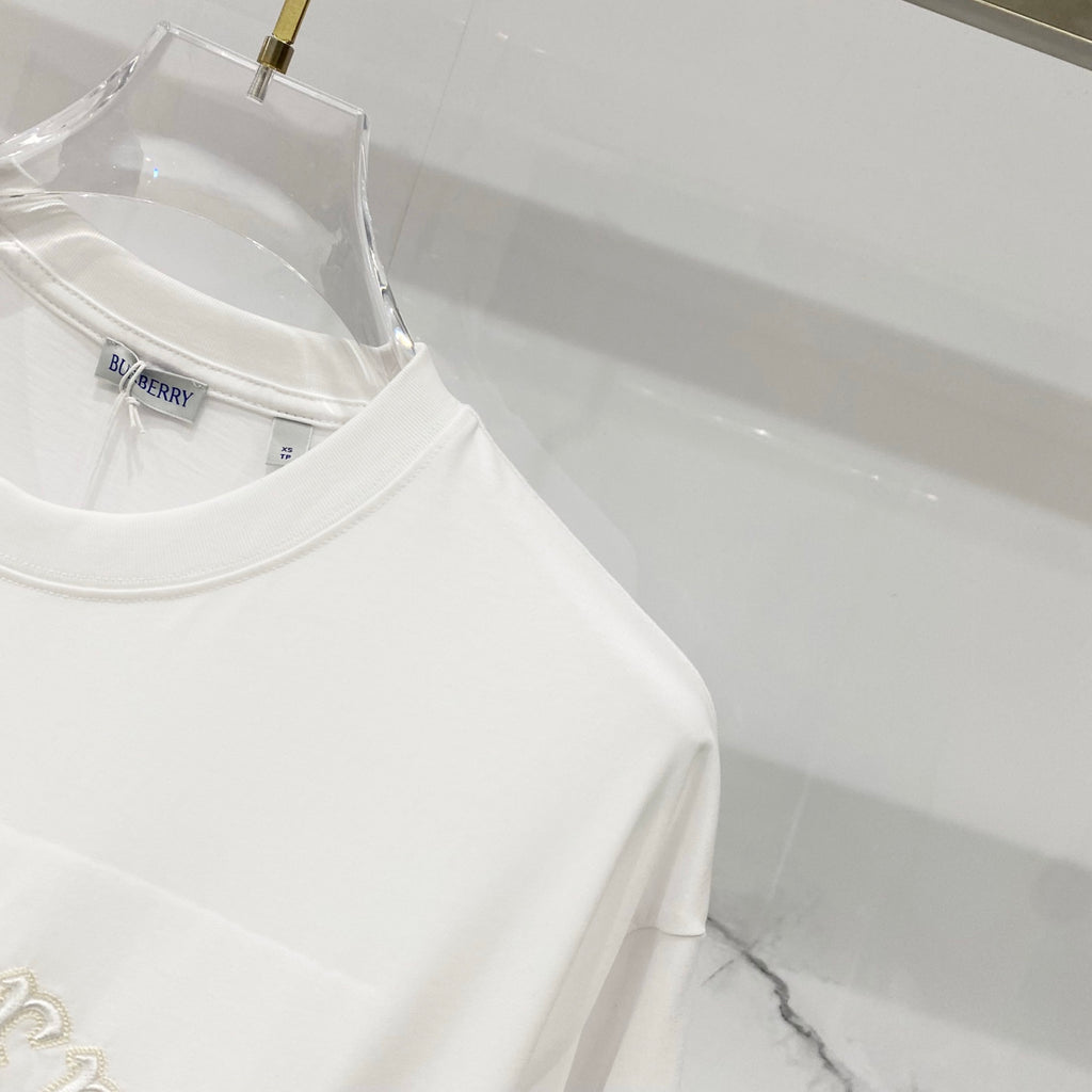 White short-sleeve T-shirt side view with clean hem and crew neckline