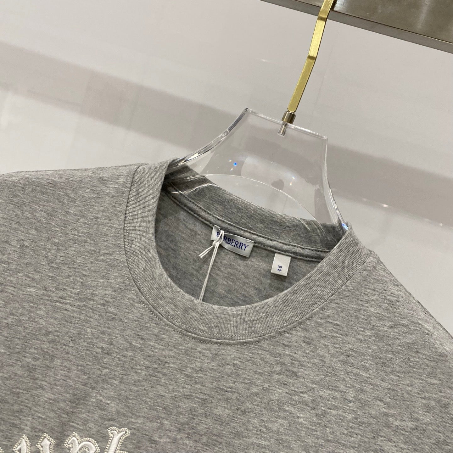 Grey crew-neck T-shirt with Burberry label inside neckline