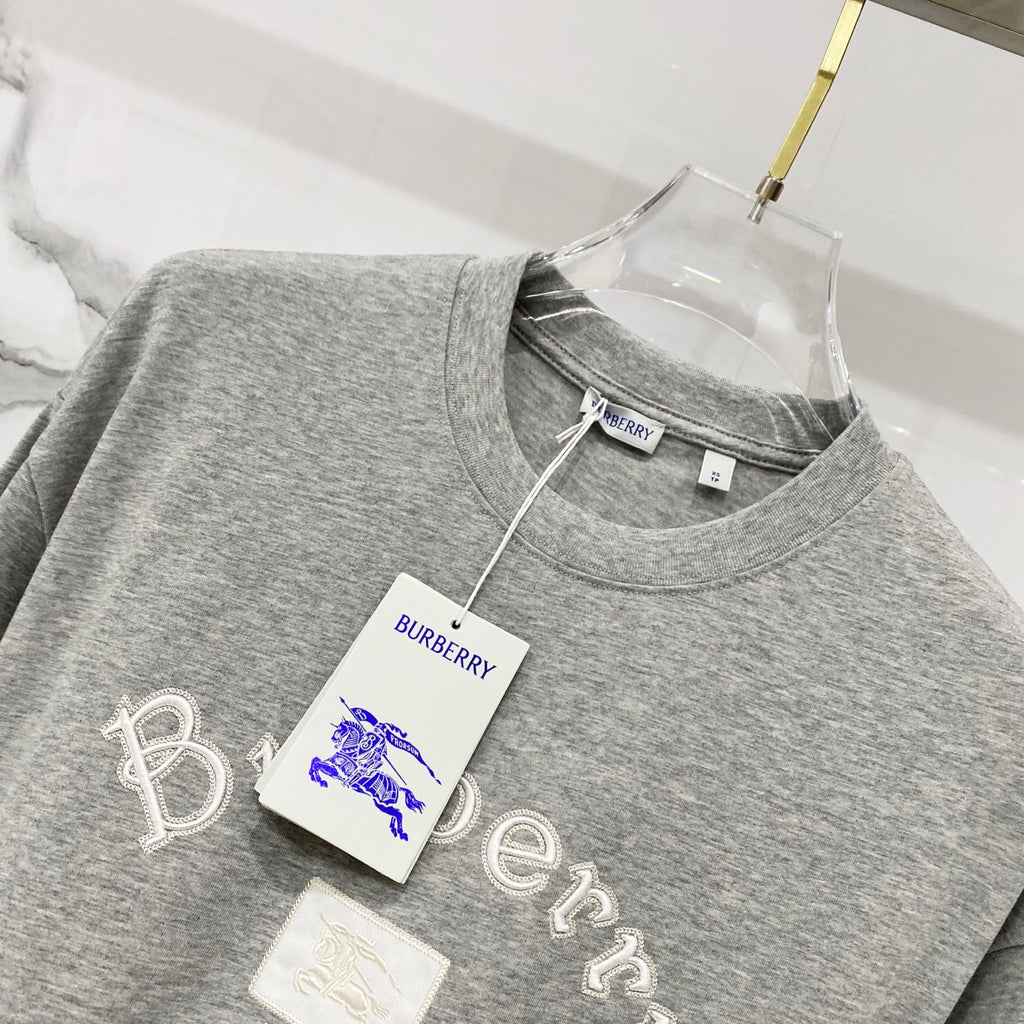 Grey short-sleeve T-shirt with Burberry hang tag on neckline