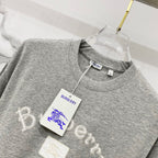 Grey short-sleeve T-shirt with Burberry hang tag on neckline