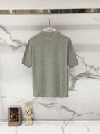 Grey short-sleeve T-shirt, back view on hanger