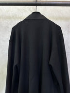 Black long coat back close-up with high collar and long sleeves